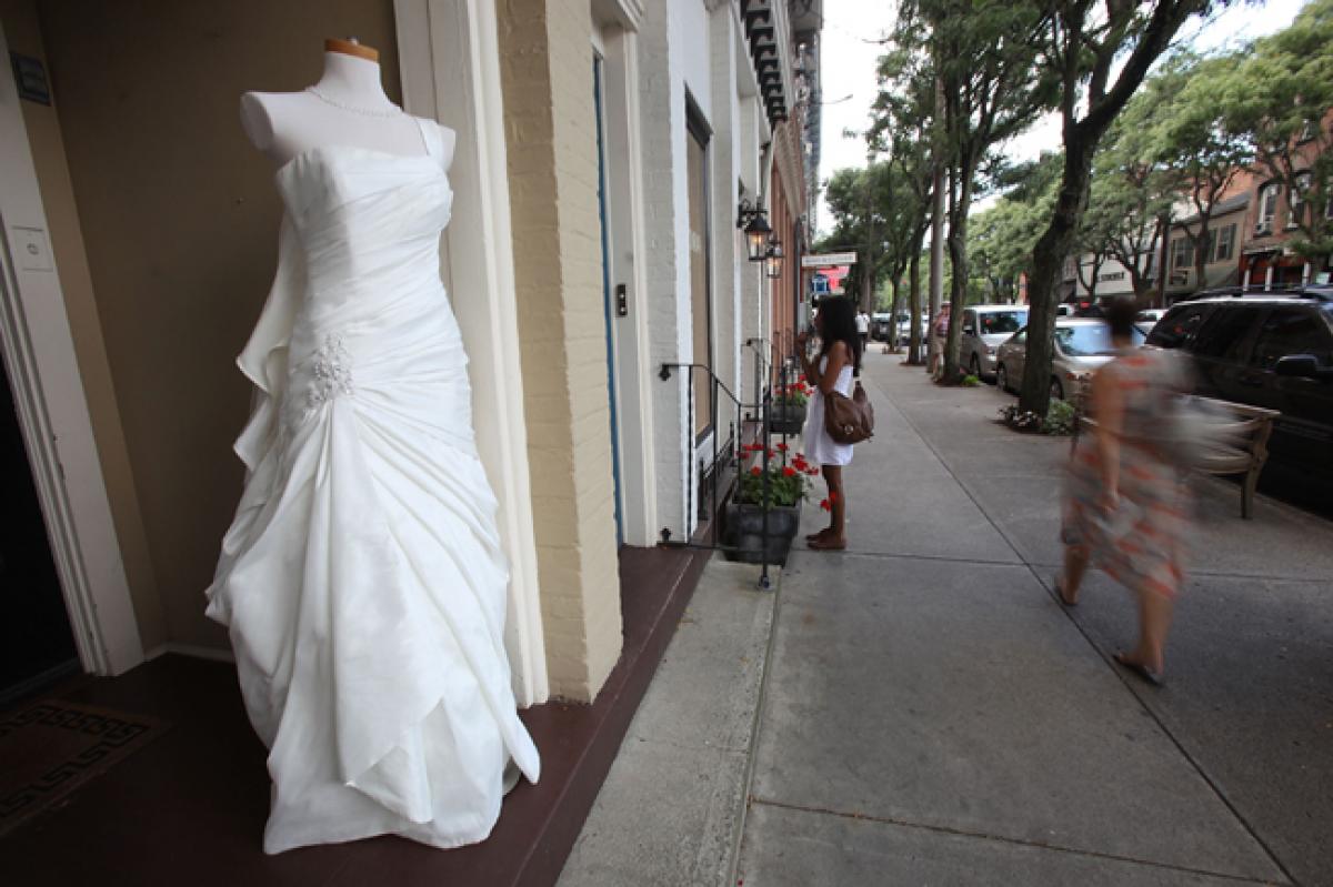 Woman sells wedding dress to pay for divorce from husband